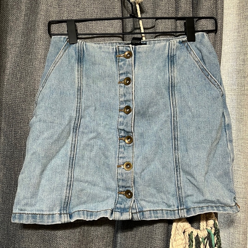 Jean mini skirt with button front closure